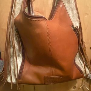 American Darling beautiful shoulder bag with tooled strap.